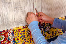 woman weaving traditional carpet