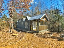purchase a tiny house or land with