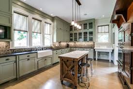 Very nice kitchen with green cabinetry, white walls, wood flooring and stainless steel appliances in a house that was once owned by vince vaughn. Green Kitchen Cabinets Pictures Options Tips Ideas Hgtv