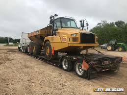 Simple operation and automotive style comfort along with combined service points and extended service intervals mean these dump trucks let you focus on your work spending less time. Articulated Dump Truck Transport Services Heavy Haulers 800 908 6206