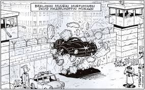 this cartoon shows a car running though the berlin wall fall of this cartoon shows a car running though the berlin wall