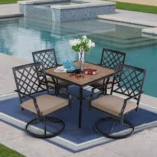 Whether on a dock, a porch, or an open air patio, these a handsome dining table complemented by cushioned or sling seating can set the stage for backyard barbecue dinners. Mf Studio Outdoor Dining Set Of 5 Metal Patio Furniture 4pcs Swivel Dining Chairs And 1pc Square Dining Table With Wooden Like Table Top Suitable For Backyard Balcony Garden And Dining Room