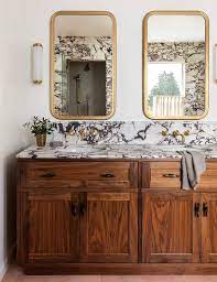 Antique Brass Mirrors Over Black And