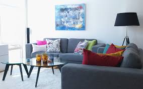 grey sofa set with colourful ter