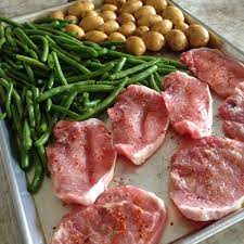 Making pork chops in the oven is super easy. Baked Thin Pork Chops And Veggies Sheet Pan Dinner Eat At Home
