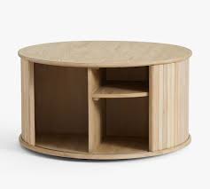 The perfect place for drinks, trays and books, this sleek design is equally at home inside, next to a modern sofa or chair. Arlo 31 Tambour Round Storage Coffee Table Pottery Barn