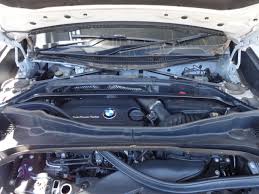 The battery in a bmw x5 is located under the spare tire in the center of the trunk. How To Replace The Car Battery On A Bmw X1 Motoring News And Advice Autotrader