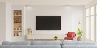 white wall mounted tv on cabinet in