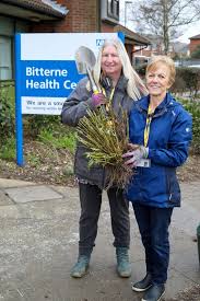 volunteer gardeners work to spruce up a