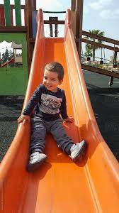 But there are so many other ways to use a slide. Little Boy Sliding Down The Slide By Acalu Studio Child Slide