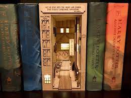 They're like little houses amongst your books. These Book Nook Shelf Inserts Turn Your Favorite Book Into A Cool Diorama Scene