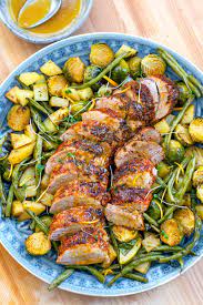 This easy pork tenderloin recipe has all the delicious flavors of pork paired with asparagus. Roast Pork Tenderloin With Orange Maple Glaze Veggies Irena Macri