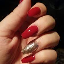 The combo of nail art and gold foil is a winning one if you wish to end up with gold foil gorgeous nails. Red And Gold Coffin Nails Perfect For The Holidays Red Christmas Nails Gold Acrylic Nails Red And Gold Nails