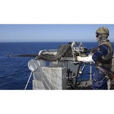 A Us Navy Gunners Mate Firing A 50 Caliber Machine Gun During Weapons Training Aboard Uss Boxer Canvas Art Stocktrek Images 37 X 22