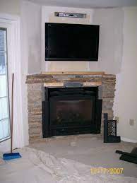 corner fireplace ideas with tv above