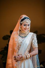 ivory lehenga with smokey eye makeup