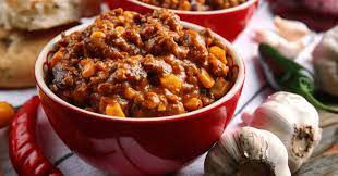 It's a spicy stew containing meat, chili peppers, tomatoes, and beans.seasonings also include onions, garlic, and cumin. What Dessert Goes With Chili 12 Tasty Ideas Insanely Good
