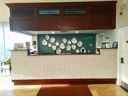 To clean kitchen cabinets that have painted surfaces, stick with dish soap and warm water — the combo is mild enough to prevent damage to the open the windows and turn on fans before using mineral spirits on the finish, as the odor is strong. Hotel In Ormond Beach Best Western Castillo Del Sol
