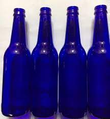 lot of 4 cobalt blue glass beer bottles