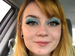 heavy makeup to spite her male coworker