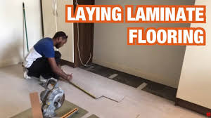 laying laminate flooring in a bedroom