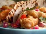 beer battered fish tacos with pickled onion and cucumber