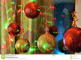Christmas Bulbs And Dancing Lights In Window Stock Photo