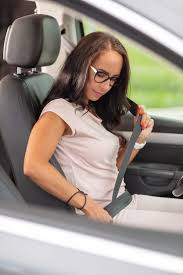 Woman In Glasses Buckles Up Seat Belt