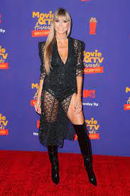 Heidi klum was born in bergisch gladbach, a small city near cologne, germany, in 1973. Heidi Klum At Mtv Movie Tv Awards 2021 Rocks Fishnet Dress Hollywood Life