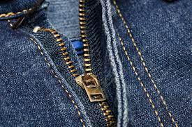 Premium Photo | Zipper lock on blue jeans close up macro
