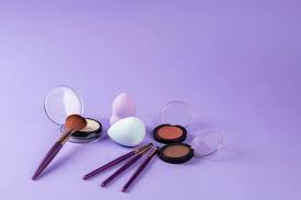 makeup tools on purple surface free
