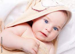 cute baby boy with blue eyes stock