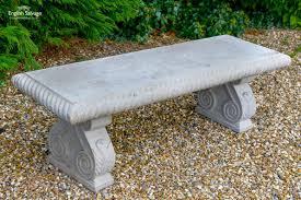 stone bench with rope detail and scroll
