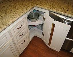 A lazy susan is a rotating cabinet insert for corner cabinets in a kitchen. Solutions For Corner Cupboards In The Kitchen Novocom Top