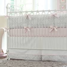 a baby girl s nursery in pink and gray