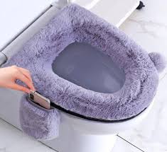 A toilet seat cover or toilet sheet is a disposable piece of paper shaped like the toilet seat itself that can be placed on the seat by its user. This Fluffy Toilet Seat Cover Comes Equipped With Its Own Phone Pocket