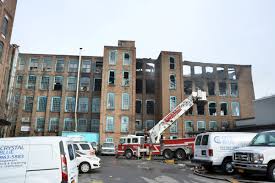 fire burns through industrial building