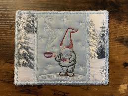 machine embroidery gnome mug rug in