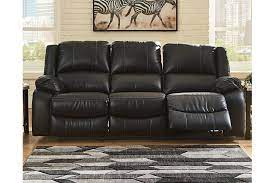 This living room sofa is all about comfort. Calderwell Manual Reclining Sofa Ashley Furniture Homestore