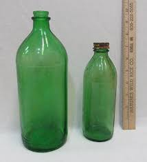 2 vintage green glass bottles duraglas