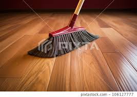 Broom Sweeping Hardwood Floor
