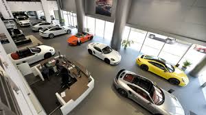 How much does car dealership in the united states pay? Porsche Centre Abu Dhabi Porsche Middle East