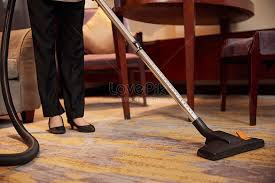 using vacuum cleaner to clean carpet