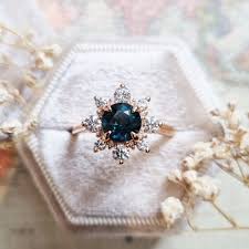 teal sapphire and diamond sunburst ring