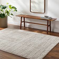 tan indoor abstract area rug