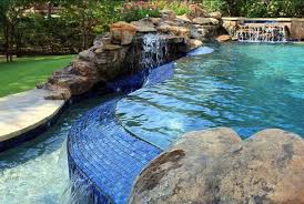 You need not focus on just one big waterfall but can also customize features to stylize your pool deck. Pool Waterfalls Pros Cons Design Ideas More Pool Research
