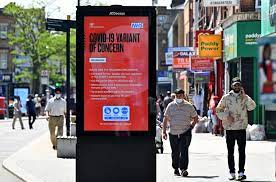 Pedestrians walk past a sign warning members of the public about the spread of coronavirus in hounslow, west london, on june 1. Covid B 1 617 2 Delta Variant What We Know