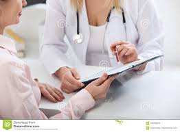 Female Doctor Holding Application Form While Consulting Patient