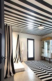 Use a commercial cleaner and sponge to scrub tiles. Black And White Striped Bathroom Shower Curtains And Rug Transitional Bathroom