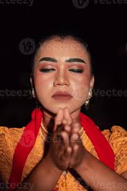 asian woman praying with both her hands